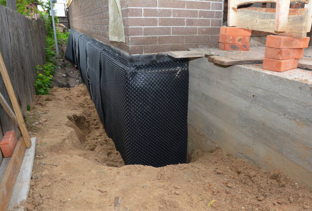 Happy homeowners after waterproofing job in Grenloch